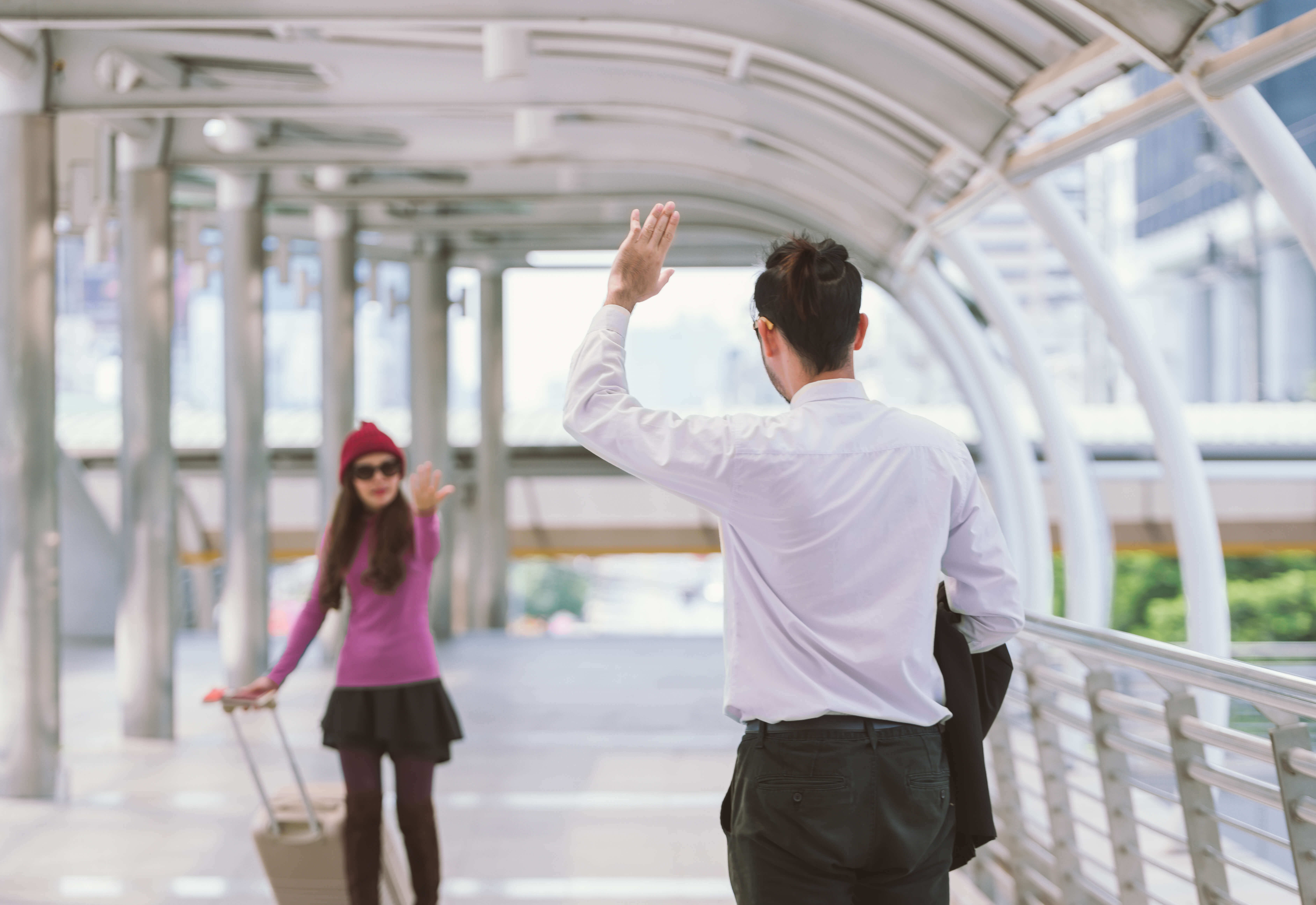 People saying Goodbye at an Airport.